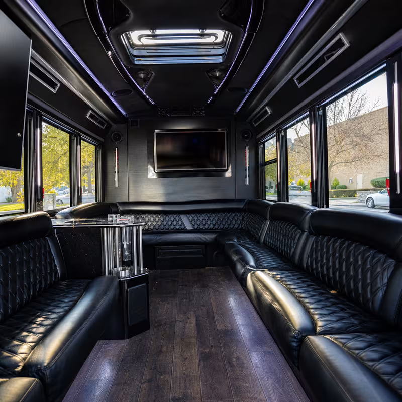 Friends laughing during a Des Moines party bus celebration