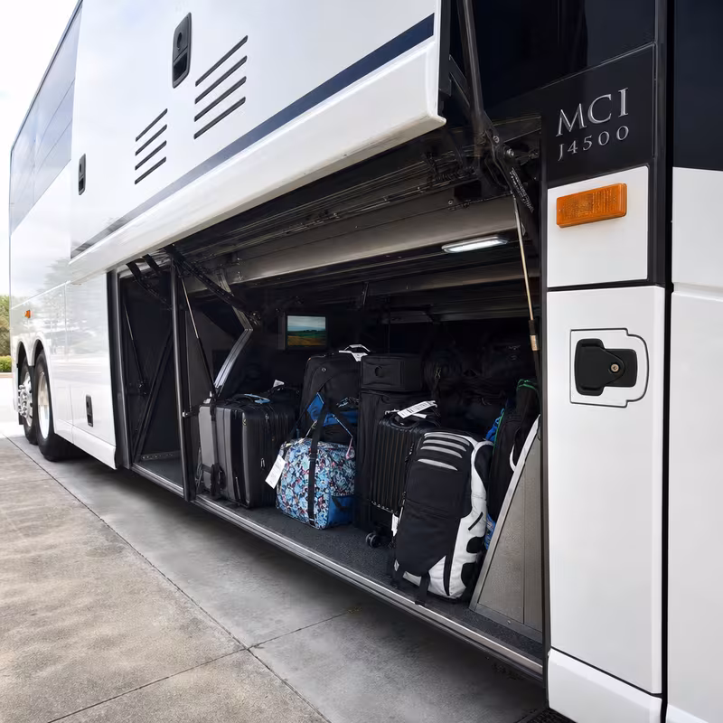 Party bus interior with wraparound leather seating and LED lighting in Des Moines