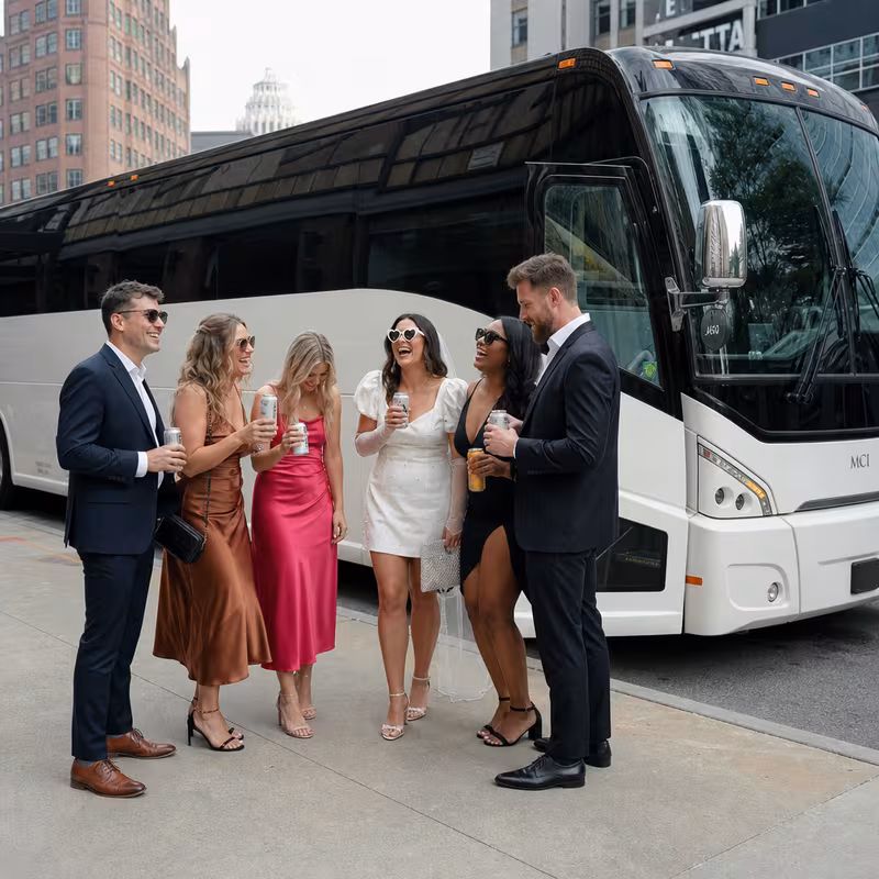 Passengers loading luggage while boarding an Des Moines group shuttle