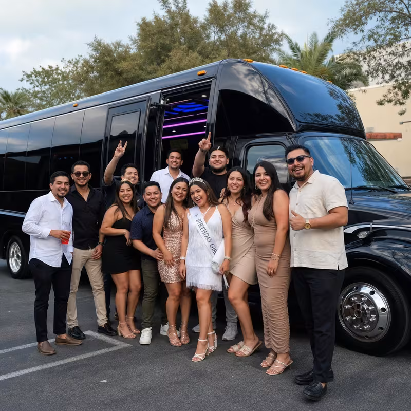 Group boarding a white charter bus for Birthday Transportation transportation in Des Moines