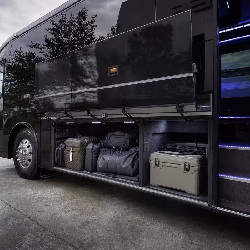 Party bus interior with wraparound leather seating and LED lighting in Des Moines