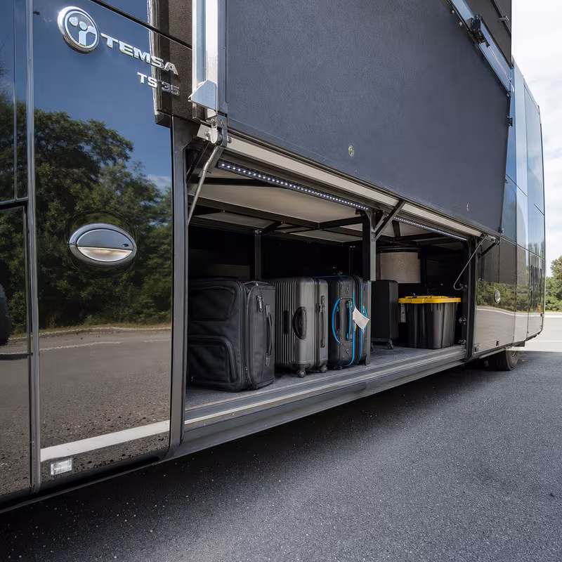 Party bus interior with wraparound leather seating and LED lighting in Des Moines