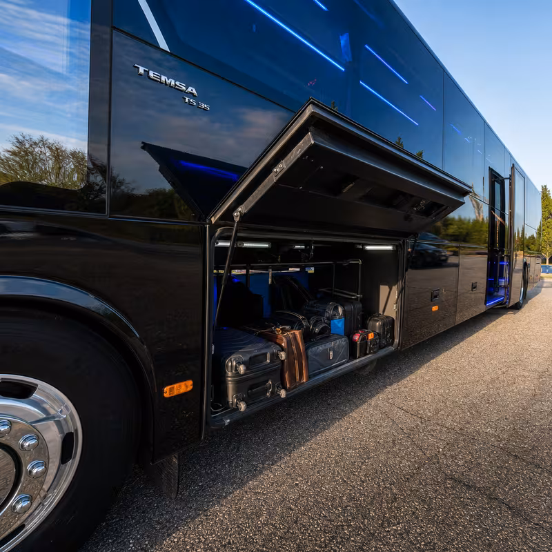 Party bus interior with wraparound leather seating and LED lighting in Des Moines